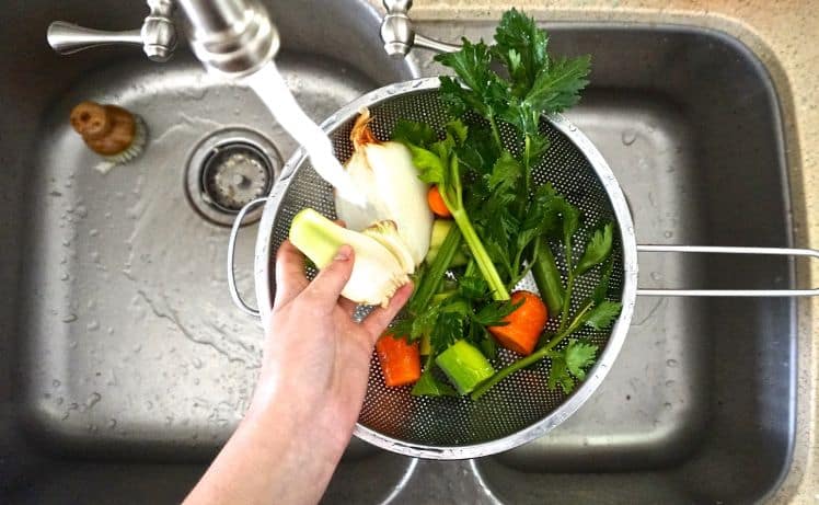overhead image of vegetables being washed