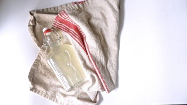 towel with a bottle of diy mouthwash