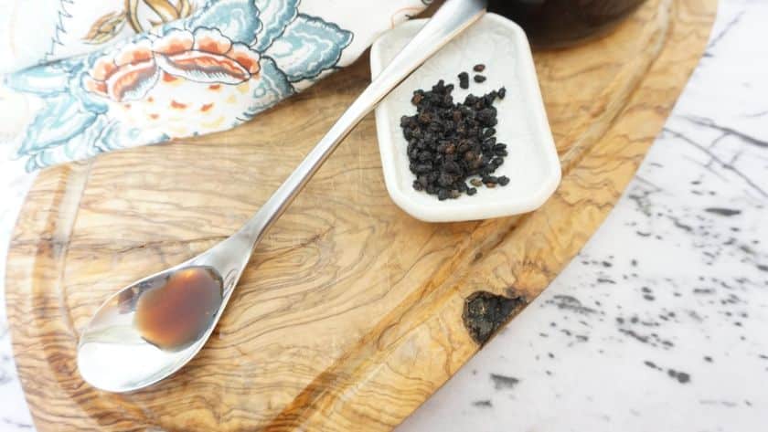 elderberry cough syrup on a spoon