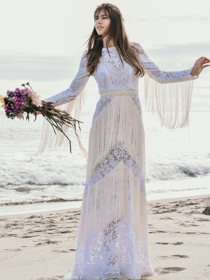 woman wearing wedding dress on beach