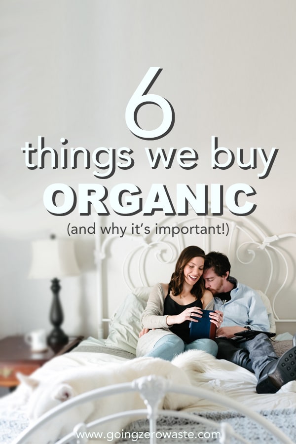 organic products - A couple and their dog sitting on a bed covered in organic sheets
