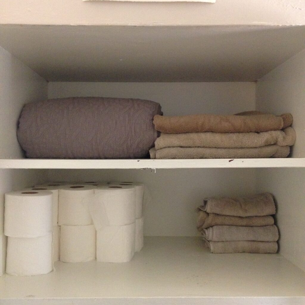 what to buy organic - a linen closet full of towels and toilet paper.