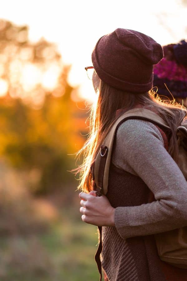 A woman hiking as an example of experience gift ideas
