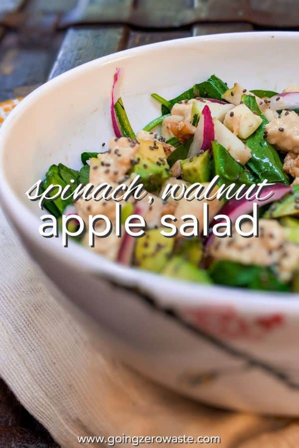 apple walnut salad in a bowl with overlay text reading "spinach walnut apple salad"