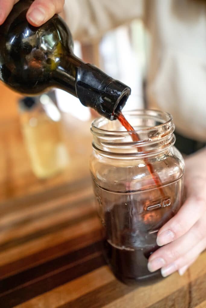 Wine being poured into a mason jar to illustrate Thanksgiving day leftovers recipes