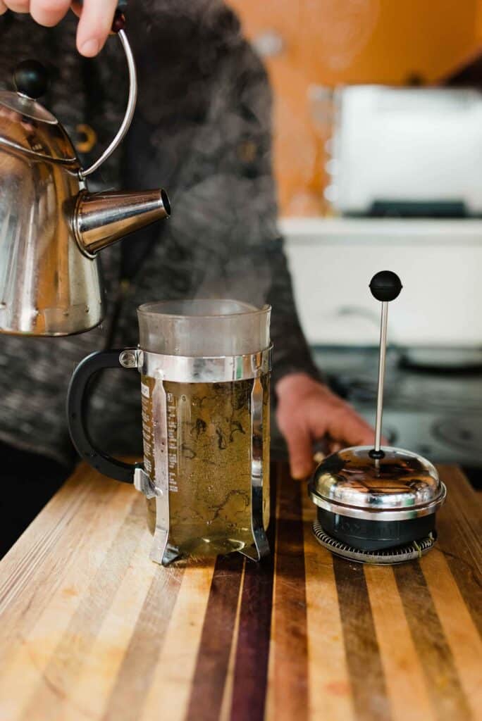 image of a French press being filled up with water
