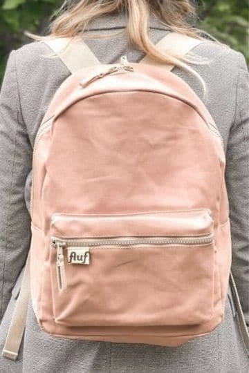 person wearing a pink backpack