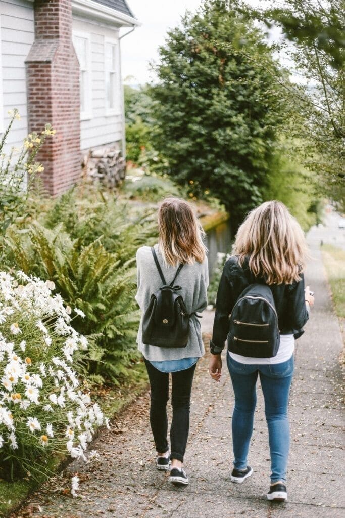 2 people with sustainable backpacks