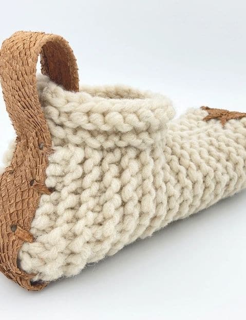 A close up of a single organic slipper made by Chilote