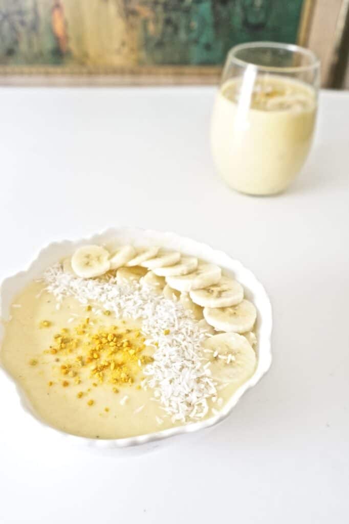 Closeup of pineapple mango smoothie served in a bowl.