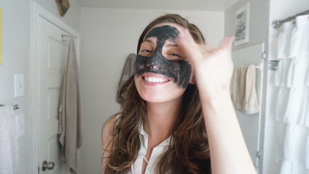 woman applying a face mask for blackheads