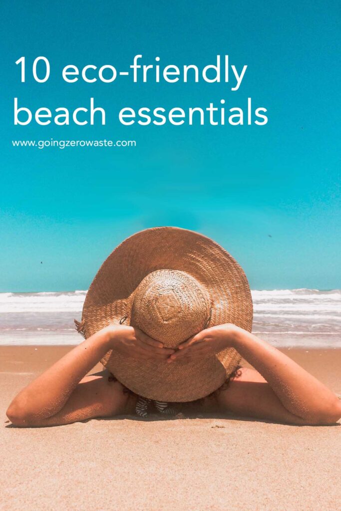 View of the back of a woman's head wearing a sunhat on the beach, with overlay text reading "10 eco-friendly beach essentials"