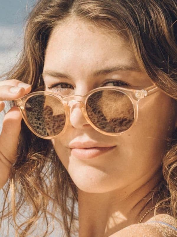 woman modeling sunski, one of these ethical sunglasses brands