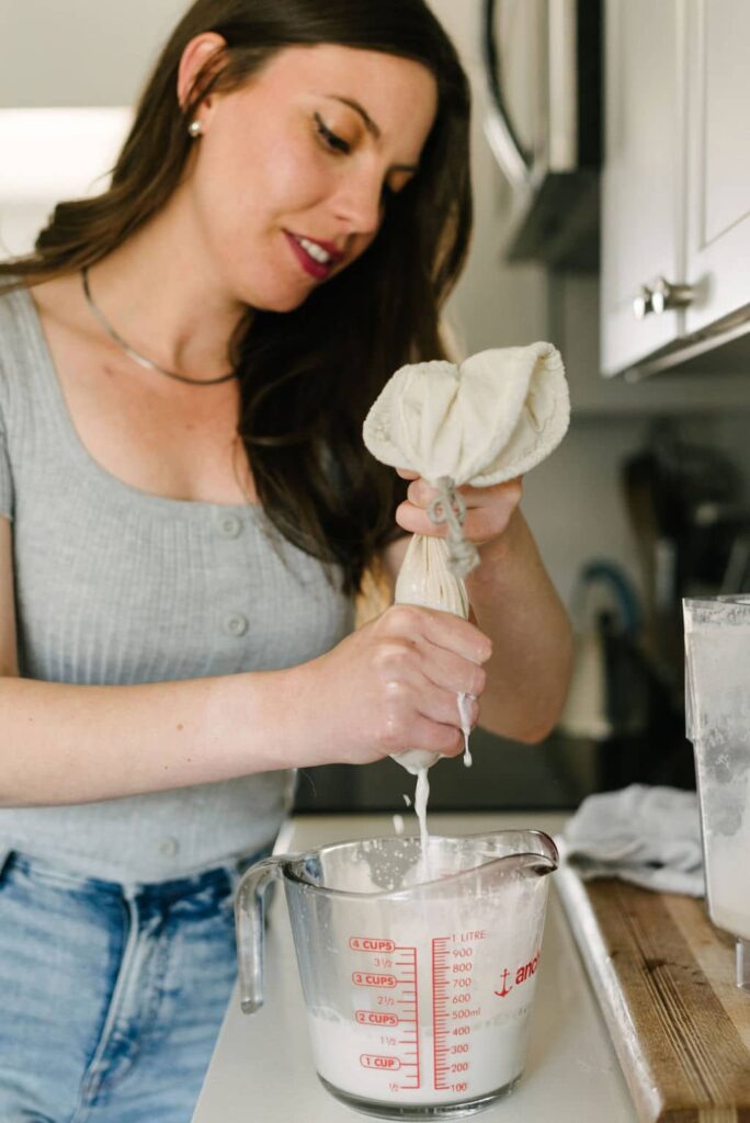 almond pulp being separated from almond milk