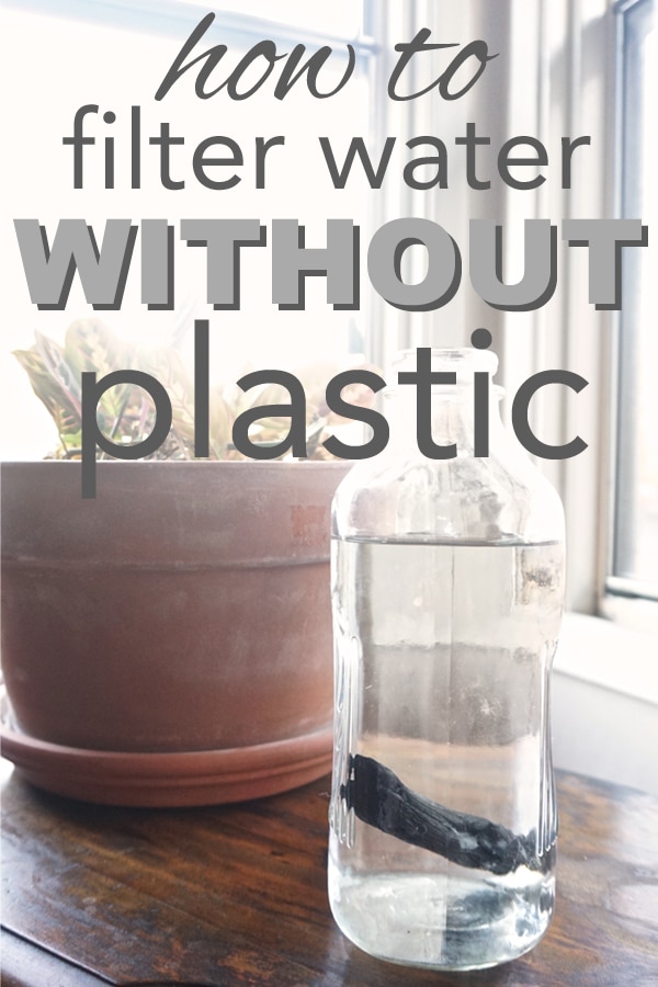 photo of a glass water bottle with a charcoal stick and overlay text reading "how to filter water without plastic"