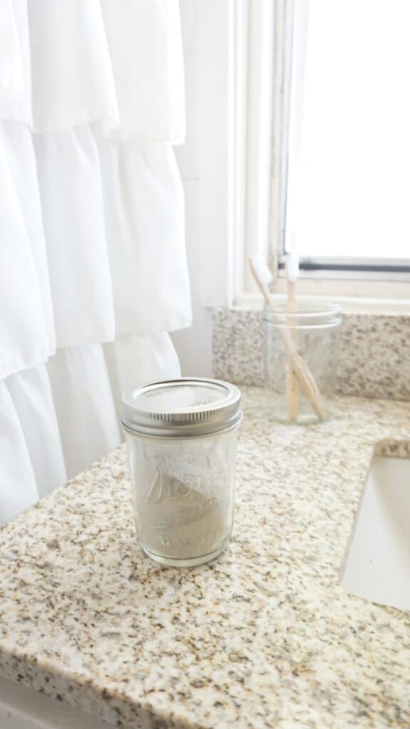 tooth powder recipe stored in a mason jar