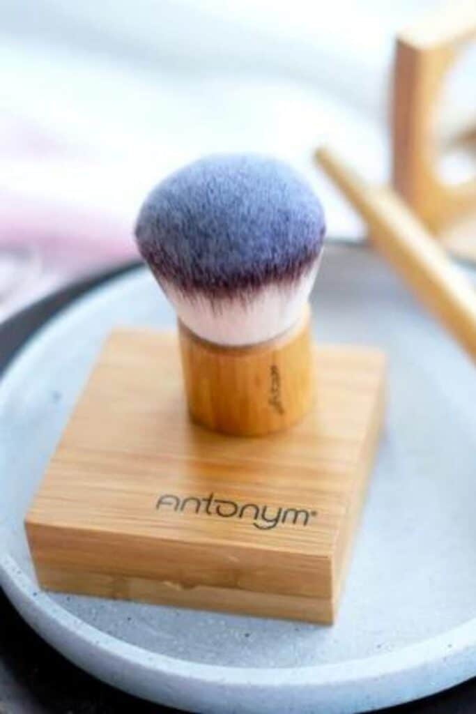 photo of compact and makeup brush from Antonym, one of the featured natural beauty brands.