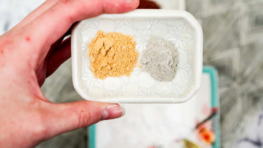 Close up of DIY makeup ingredients ginger powder and bentonite clay