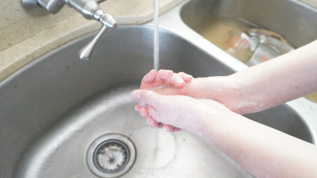 Woman washing her hands with her DIY shampoo bar