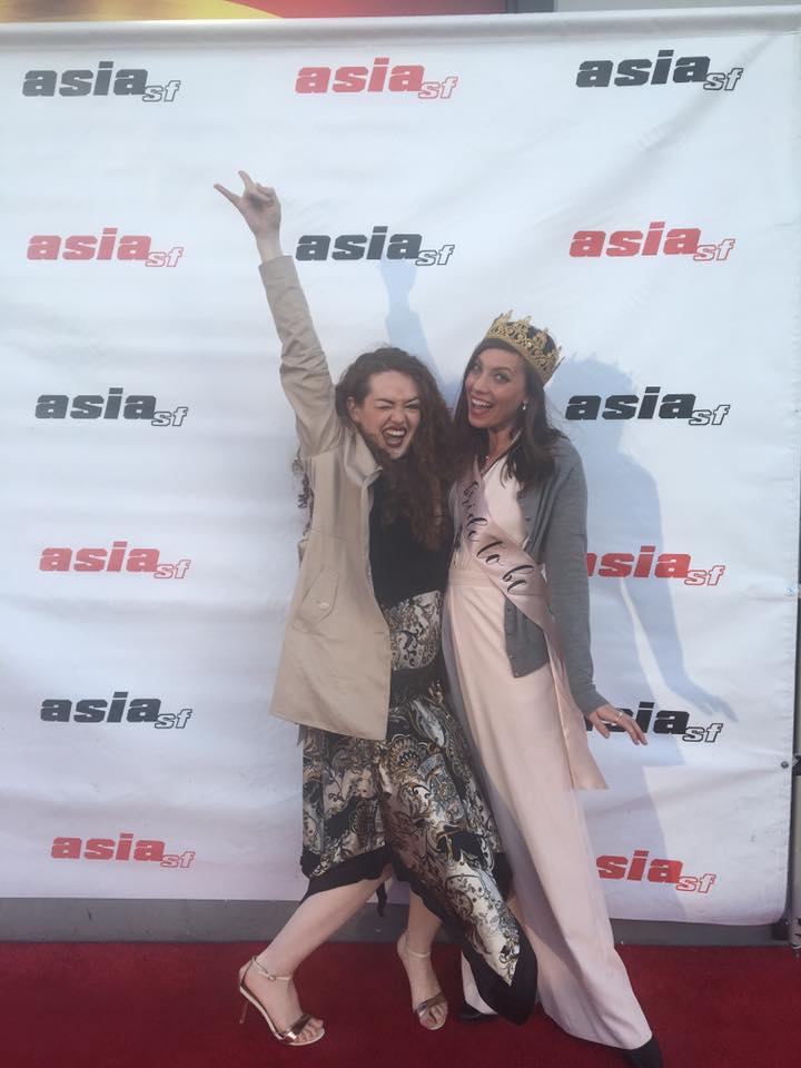 two women posing at a bachelorette party.