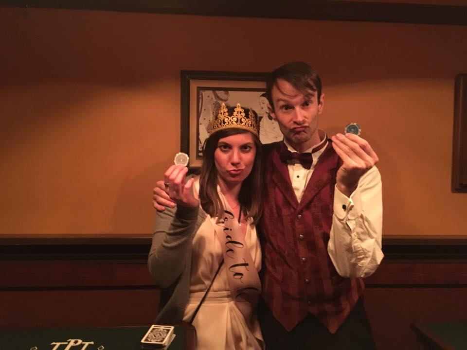 woman and blackjack dealer posing with eco friendly party decorations.