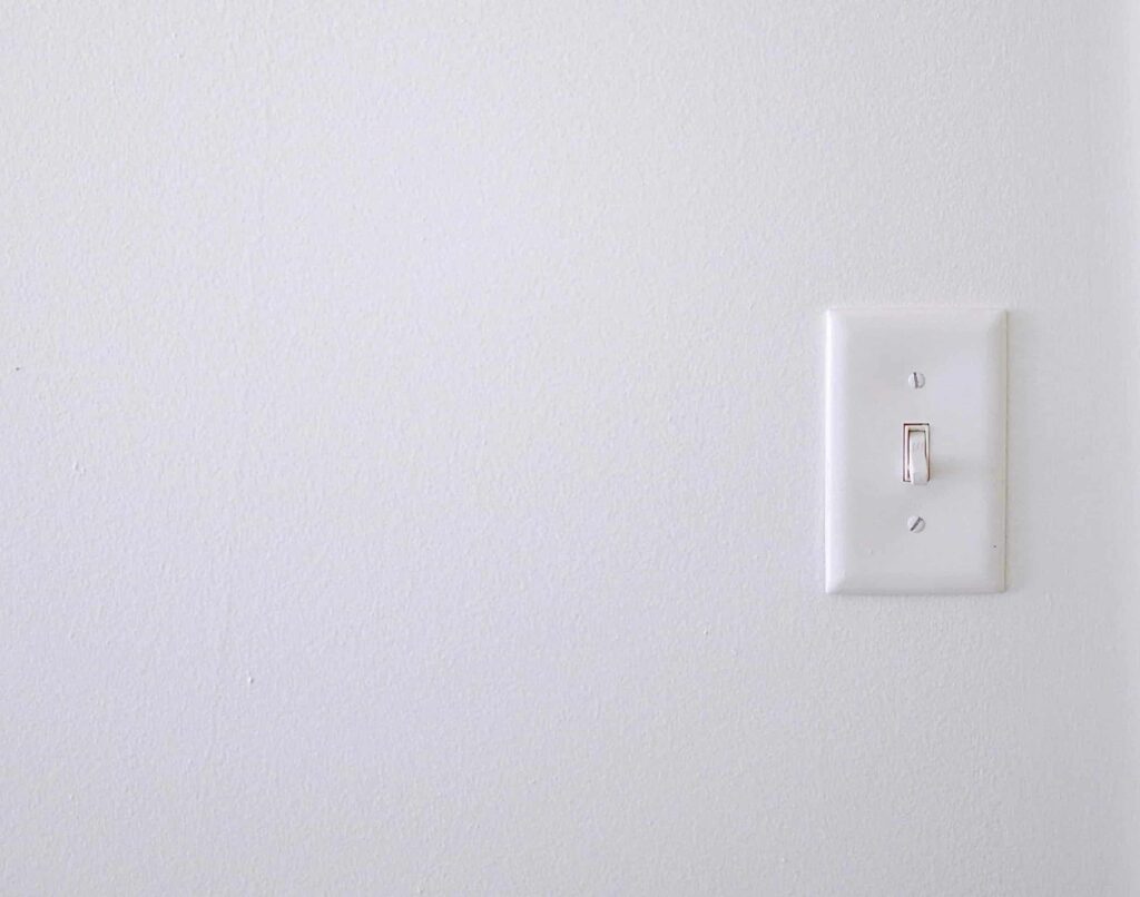 a light switch to illustrate a smart power strip turning off phantom electricity. An affordable sustainable technology