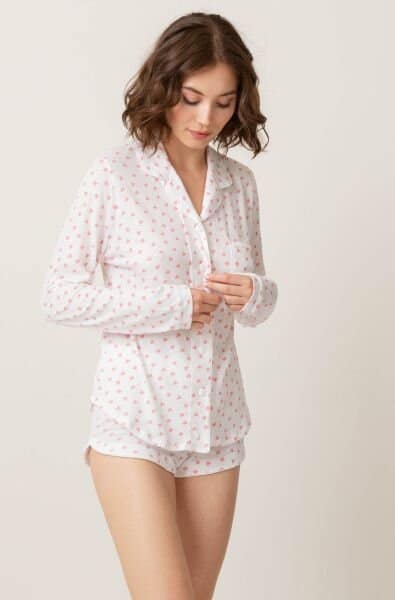 Woman wearing heart pajamas