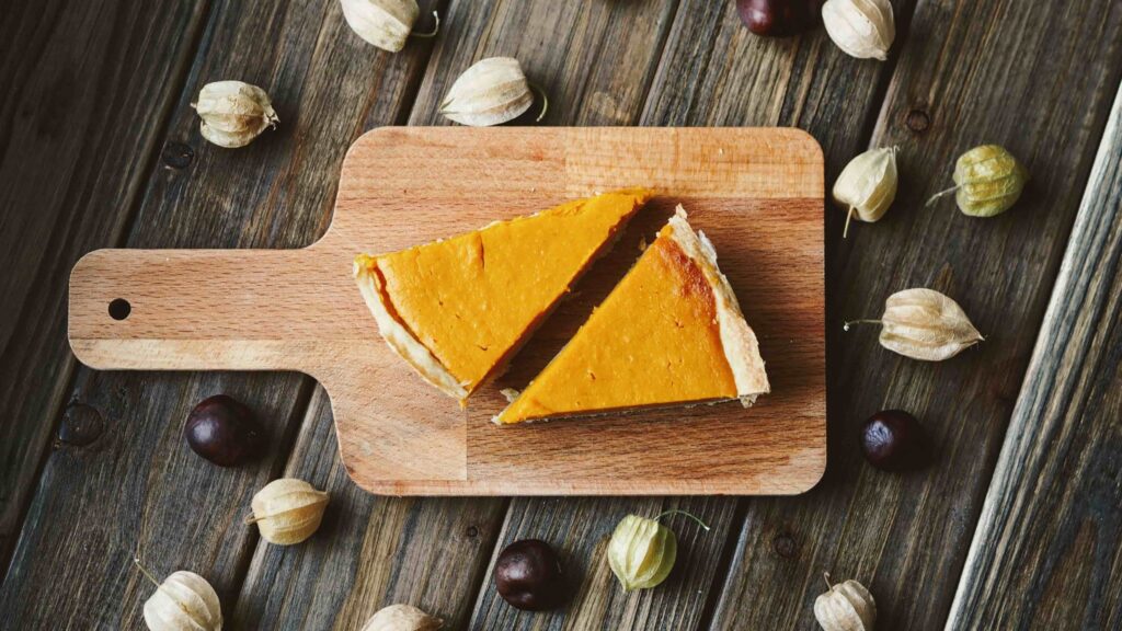 Top view of 2 slices of pumpkin pie to depict this pumpkin pie filling, one of our favorite pumpkin dessert recipes. 