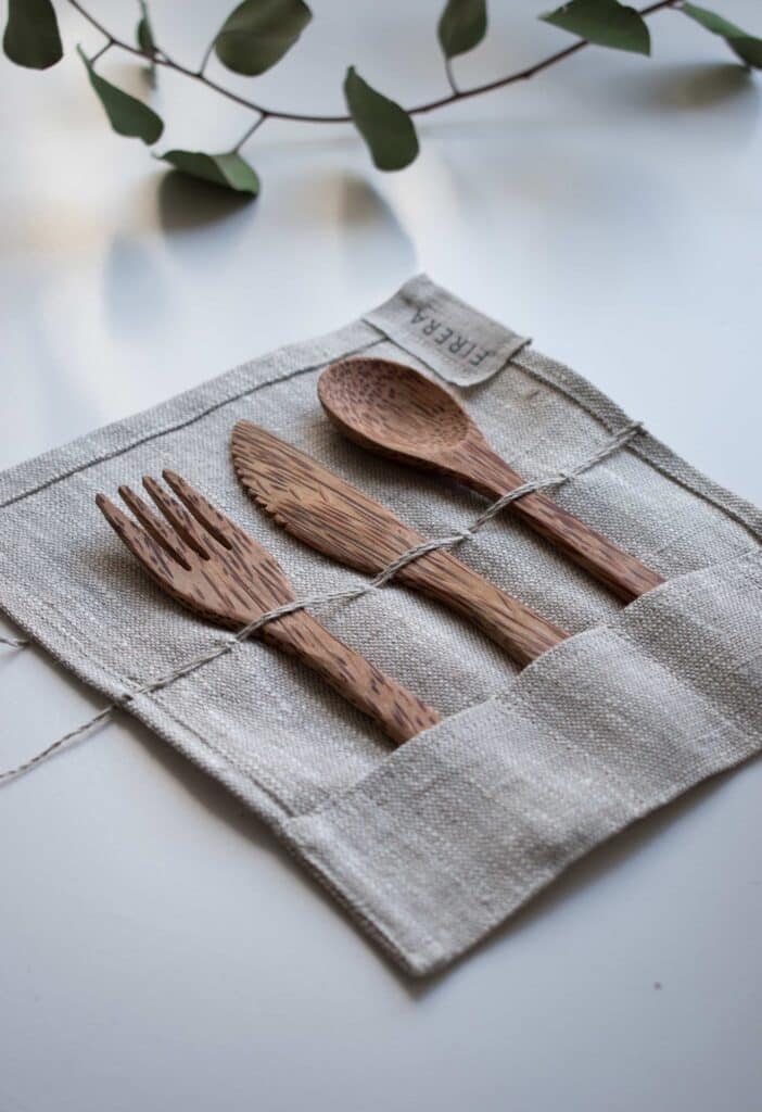 wooden, reusable flatware in a cute carrying case are easy sustainable swaps to disposable flatware.