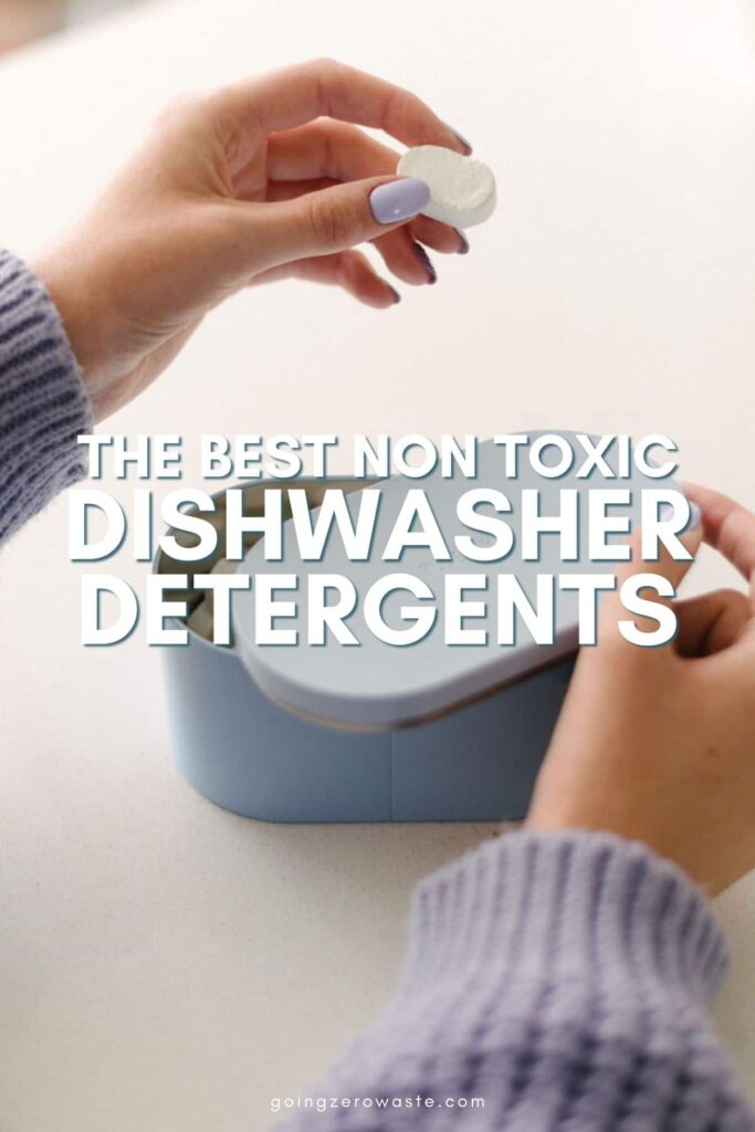 A woman's hand holding a detergent tab with overlay text reading "The Best Non Toxic Dishwasher Detergents"