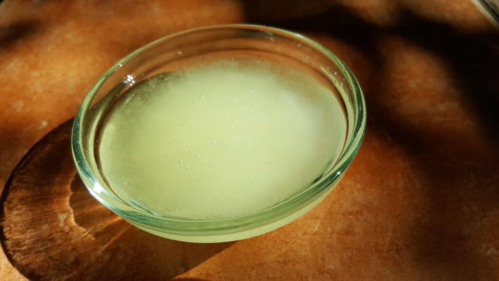 a bowl of melted coconut oil, one of the suggested natural sunburn remedies. 