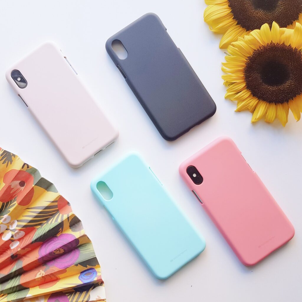 4 sustainable phone cases - 1 light pink, 1 bright pink, 1 navy, and 1 sky blue. 