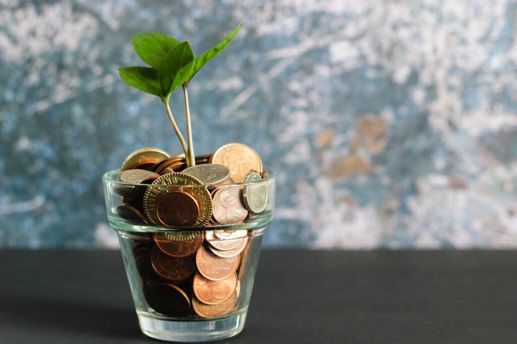 A cup of change with a plant 'growing' out of it to illustrate a post about careers in environmental science.