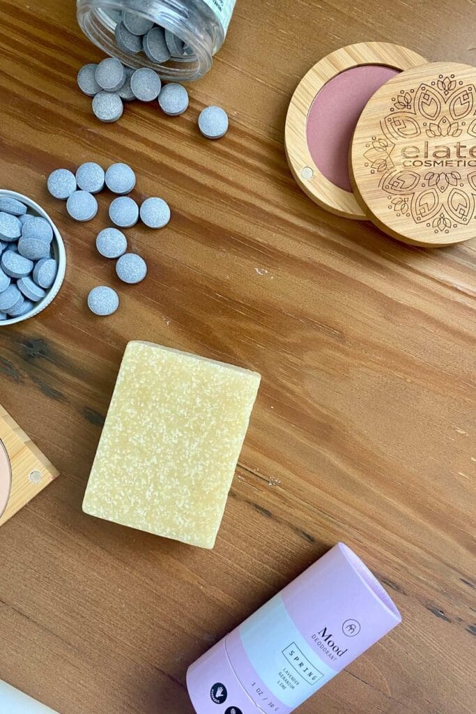 Top view of beauty products - supplements/vitamins, makeup, and soap to illustrate Amazon alternatives for beauty products