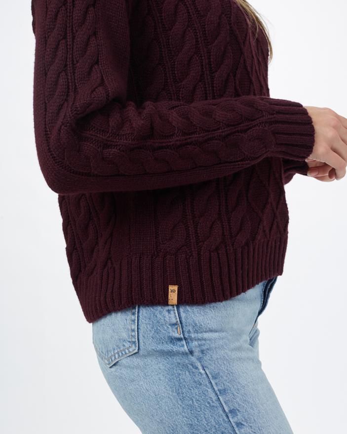 Hemp clothes - a woman wearing a maroon sweater and jeans.