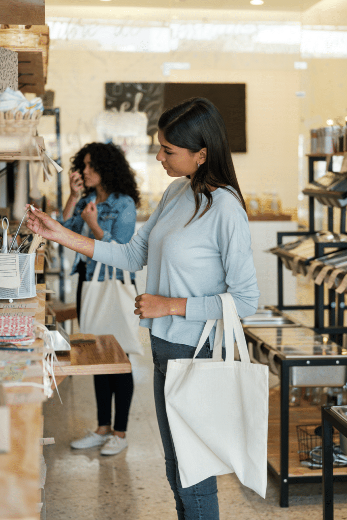 Woman shopping at a sustainable store to illustrate how to start a zero waste store 