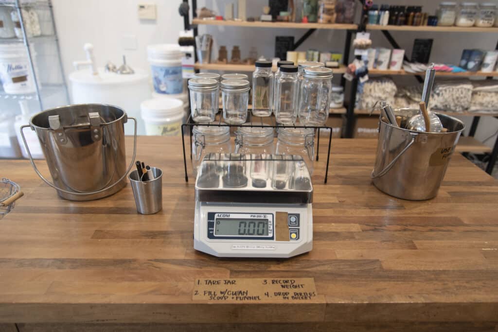 A photo of a scale with refillable tare jars in my zero waste store 