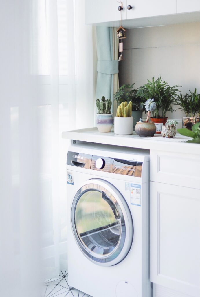 A washing machine to illustrate that True Earth eco-strips laundry detergent are machine friendly 