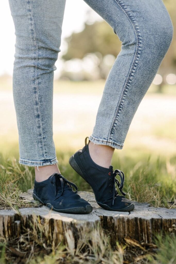 Close up of a woman wearing black sneakers for her Wildling Shoes review