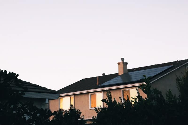 Benefits of solar panels on a house - a home with solar panels on the roof. 