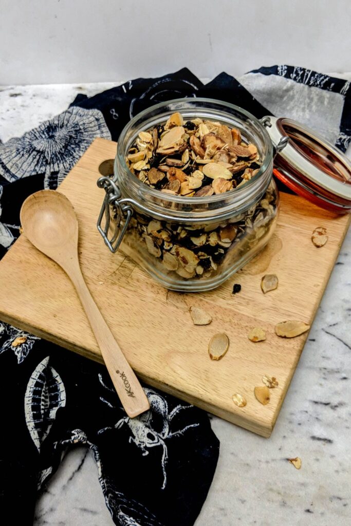 GF granola recipe in a storage jar.