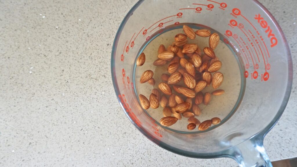 almonds soaking before being placed in nut bags for making milk